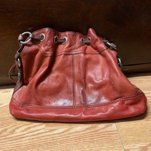 Red vintage fossil bucket bag